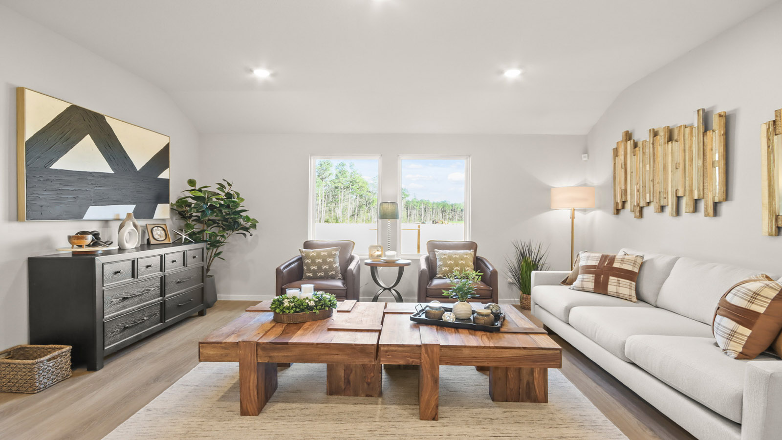 Spacious living area with vinyl flooring
