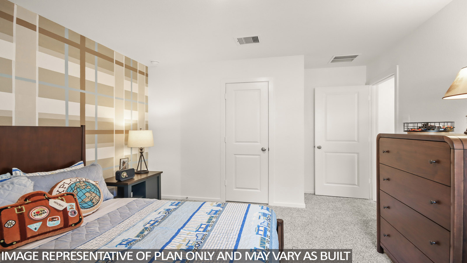 Secondary bedroom with carpet flooring