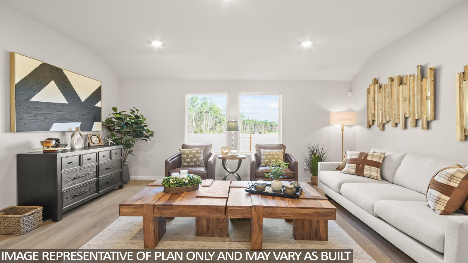 Spacious living area with vinyl flooring