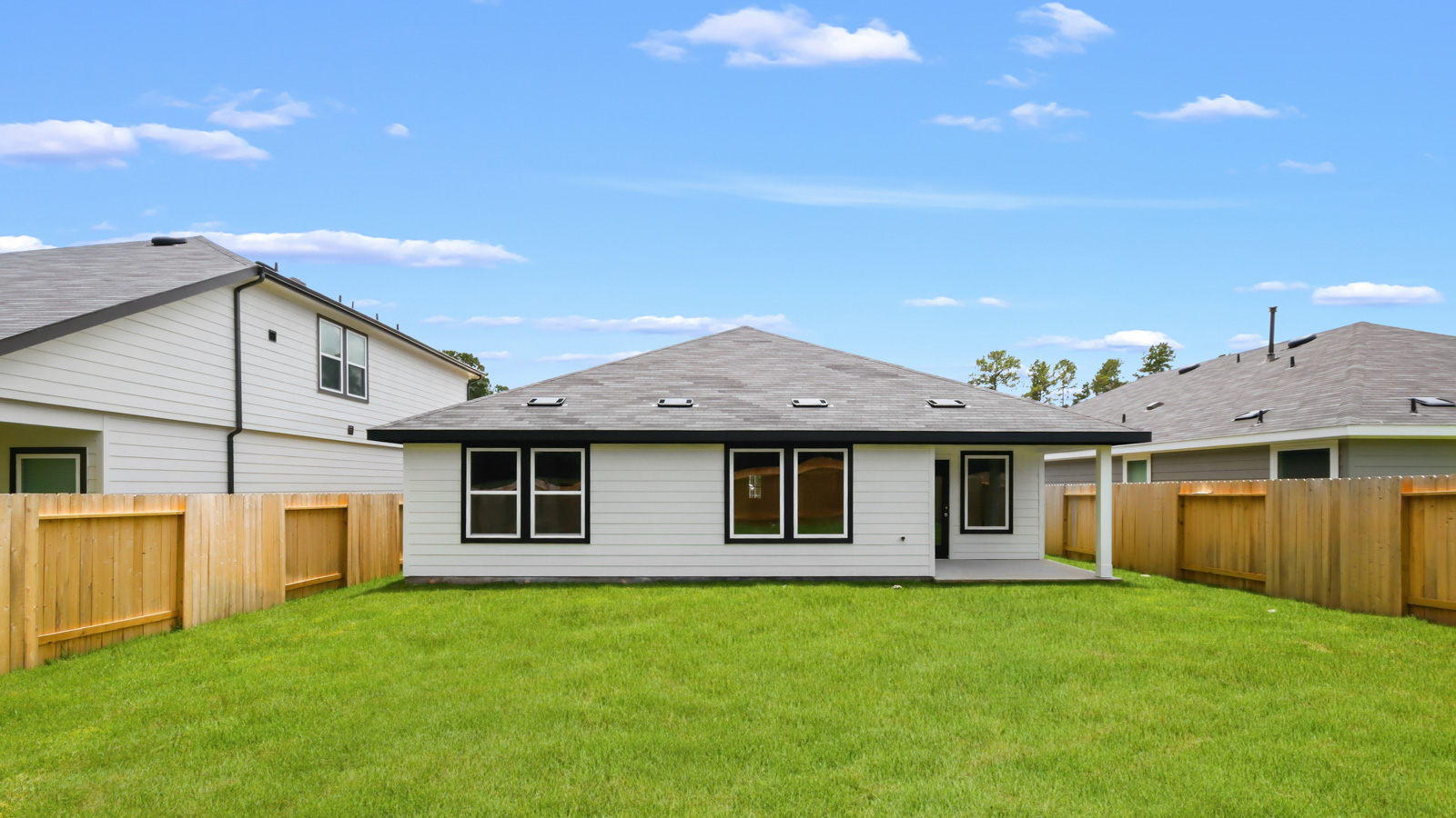 back of house with james hardie siding and glass back door
