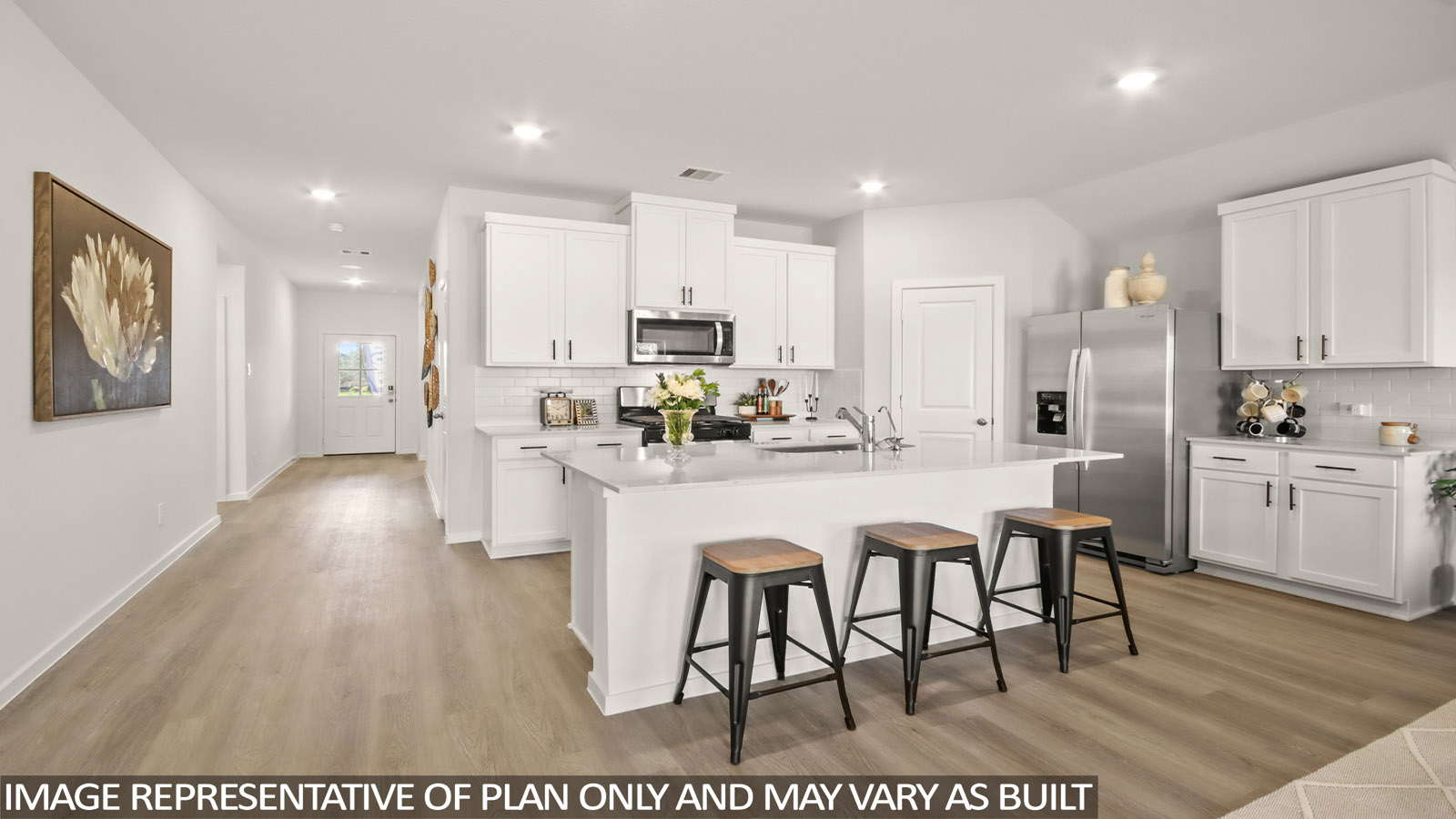 Kitchen with an island and vinyl floor