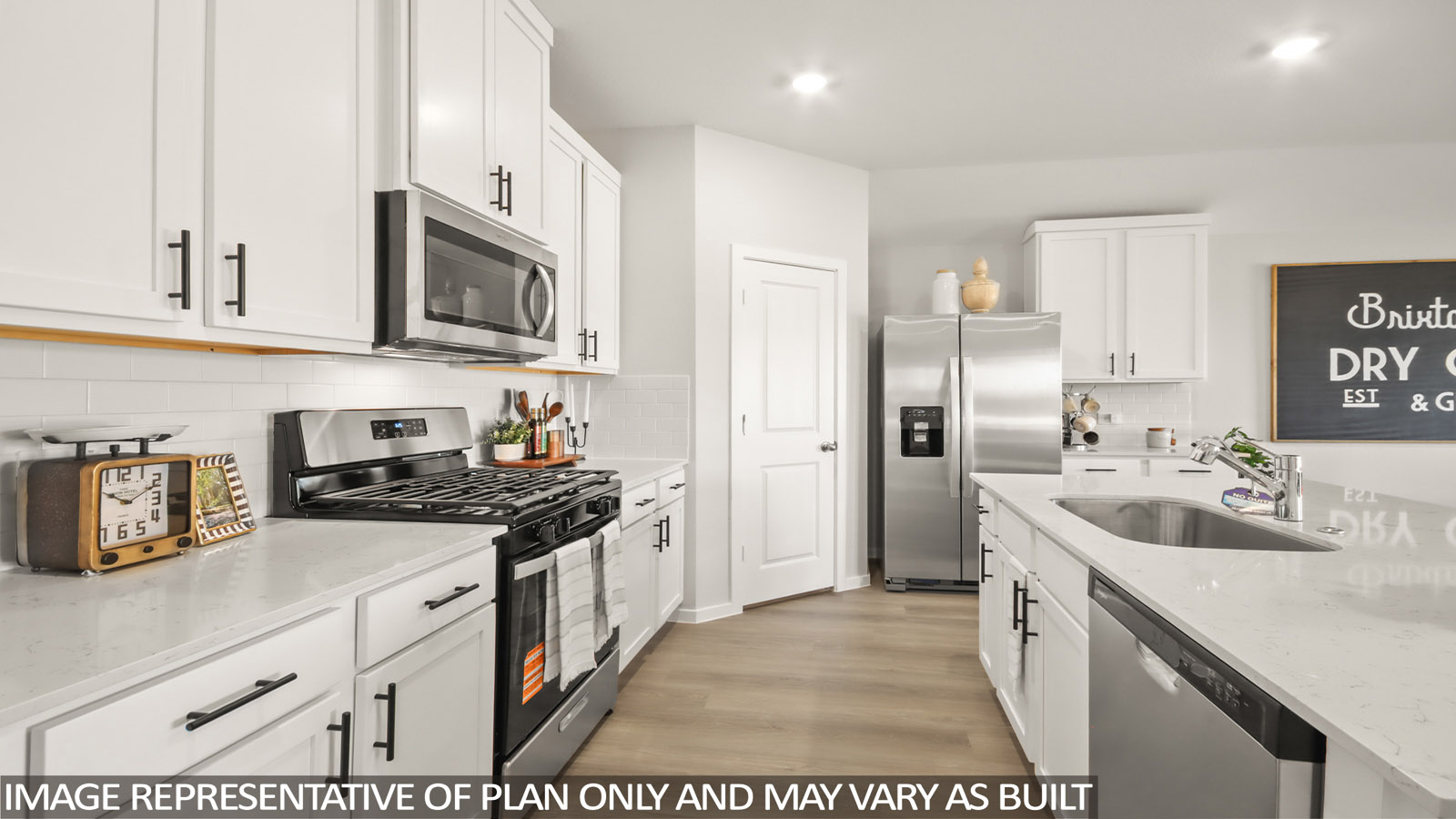 Kitchen with an island and vinyl floor