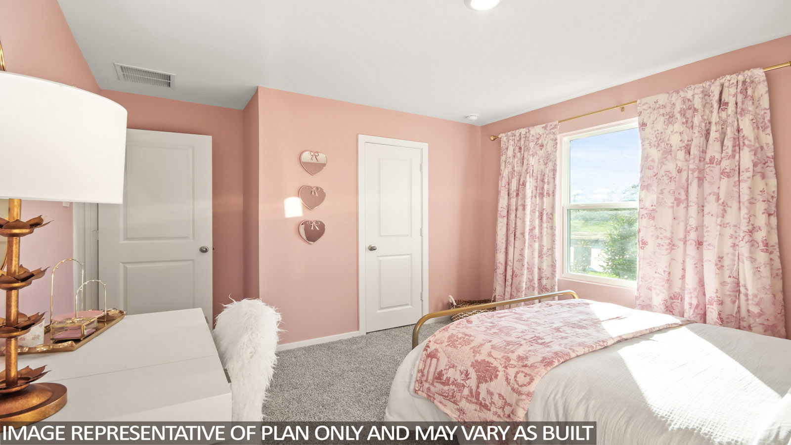 Secondary bedroom with carpet flooring