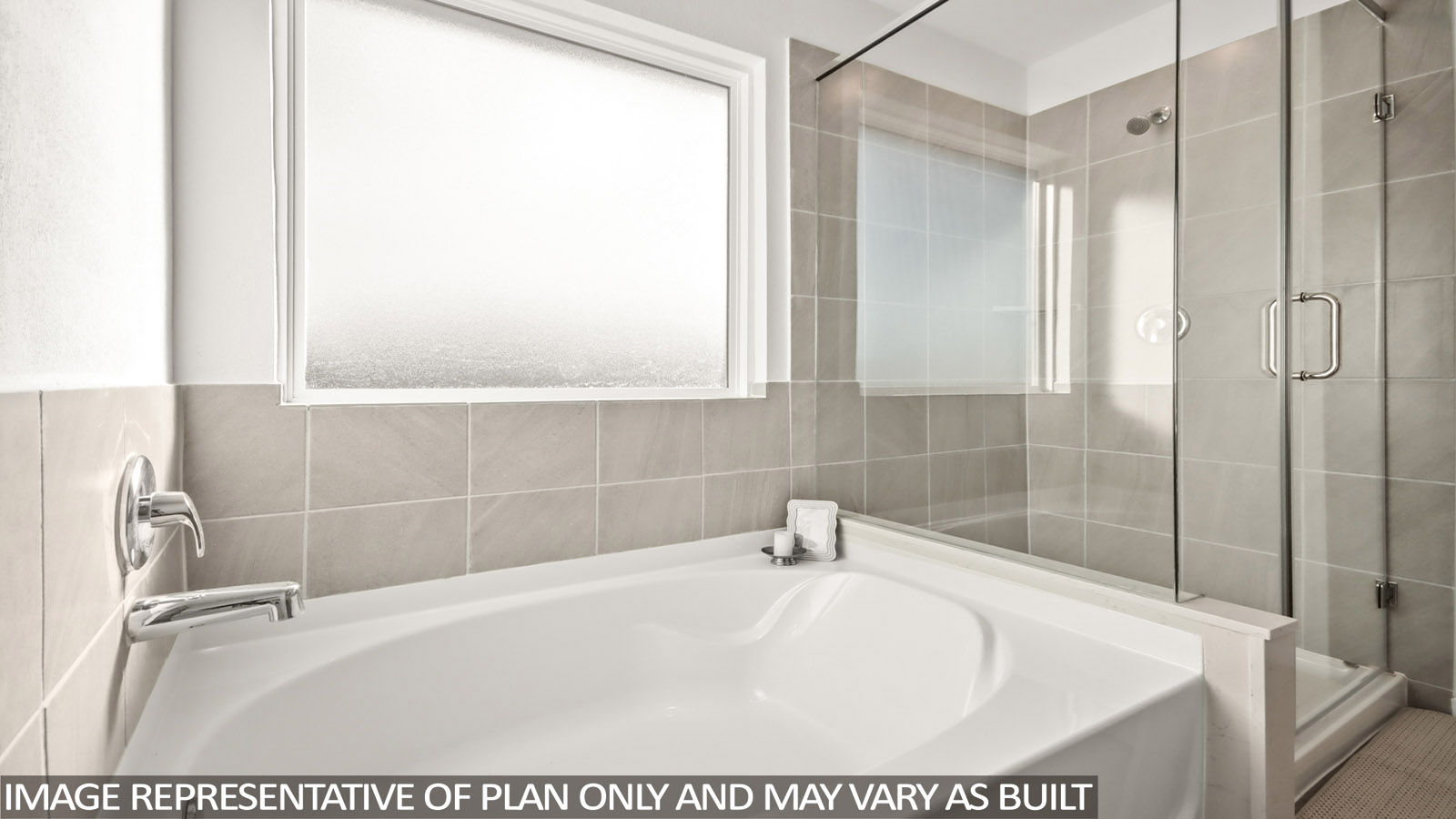 Primary bathroom with soaker tub and tile shower with semi frameless glass in New Waverly TX