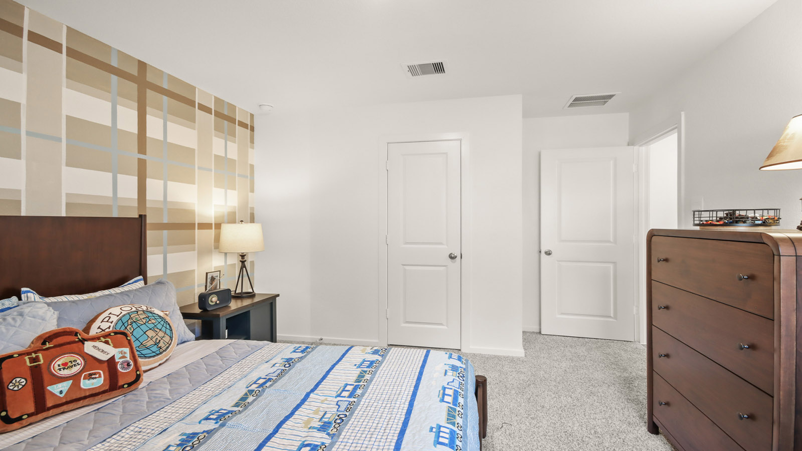 Secondary bedroom with carpet flooring