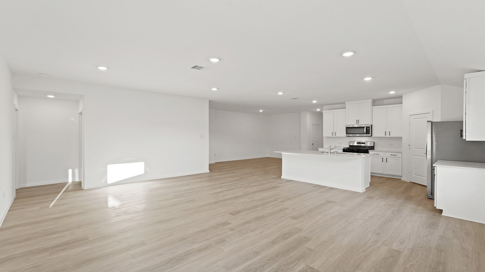 Open concept living, dining, and kitchen area