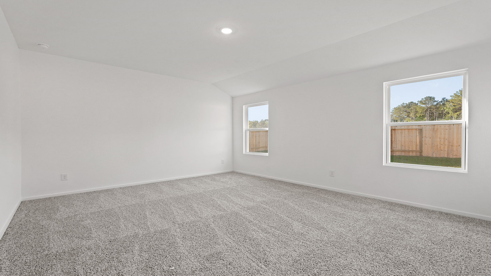 Primary bedroom with carpet flooring