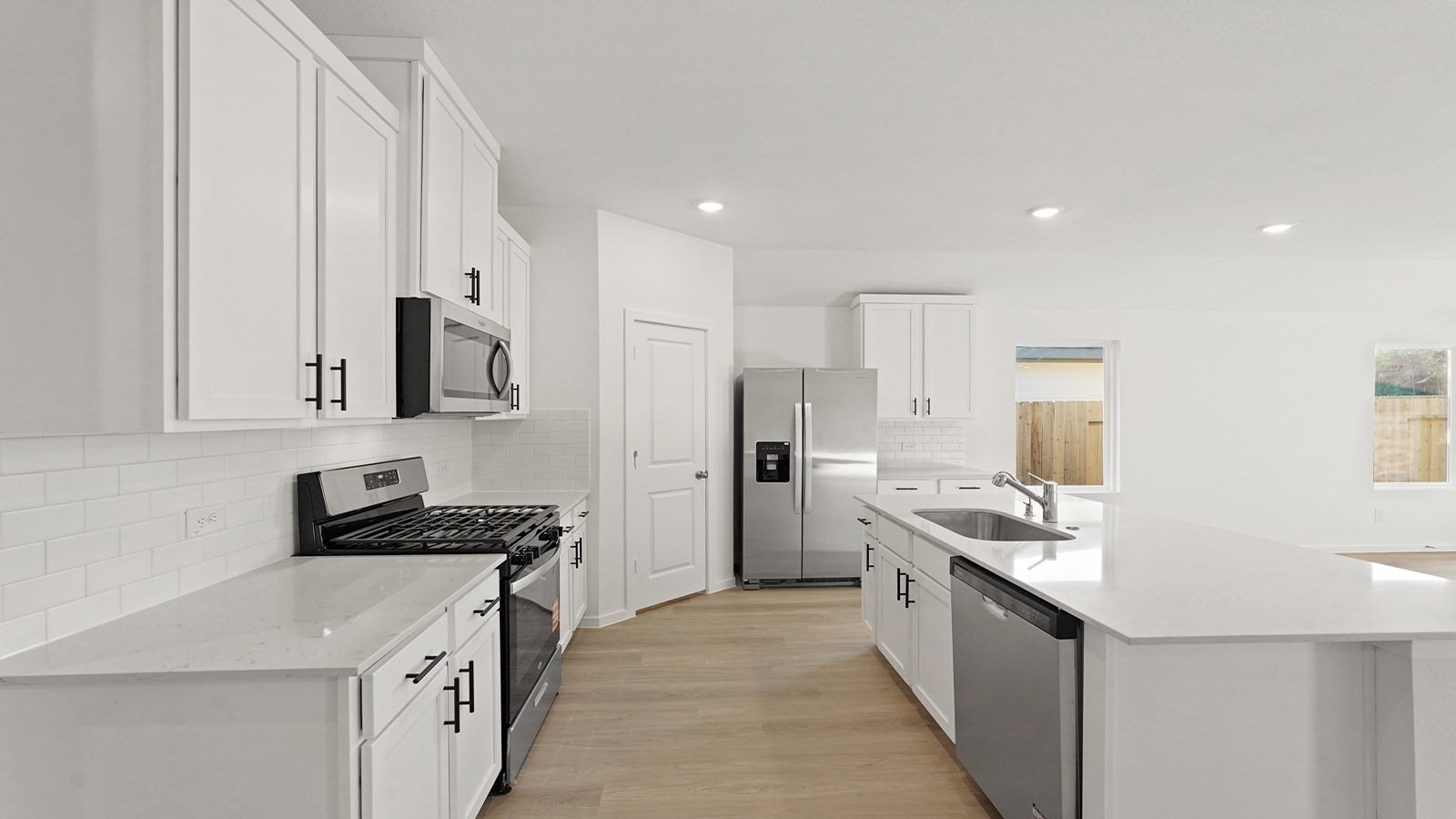Kitchen with an island and vinyl floor
