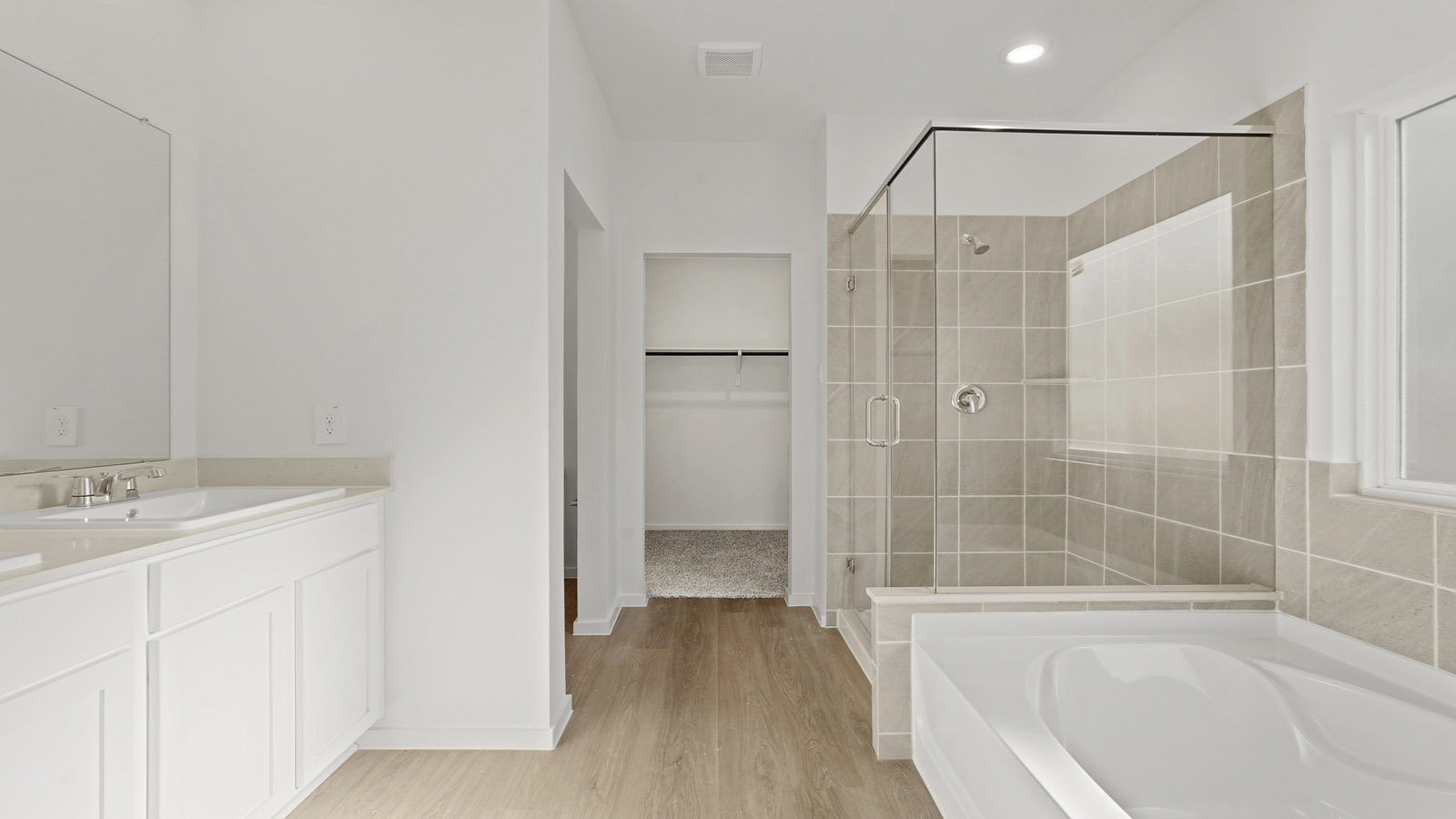 Primary bathroom with tub and shower