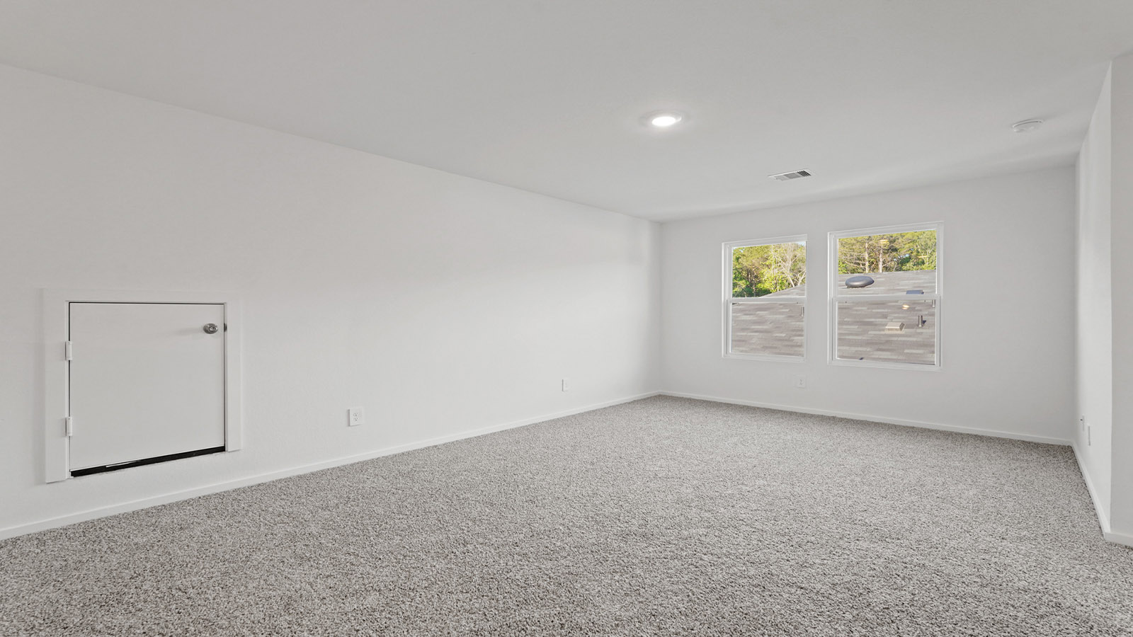 Second story game room with carpet flooring
