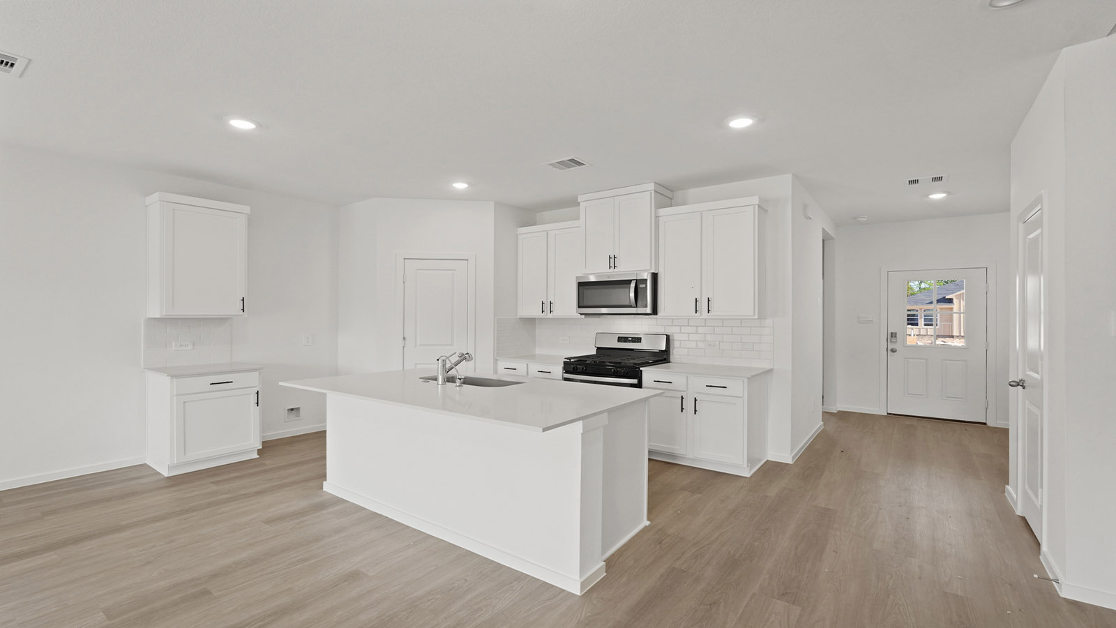 Kitchen with an island and vinyl floor