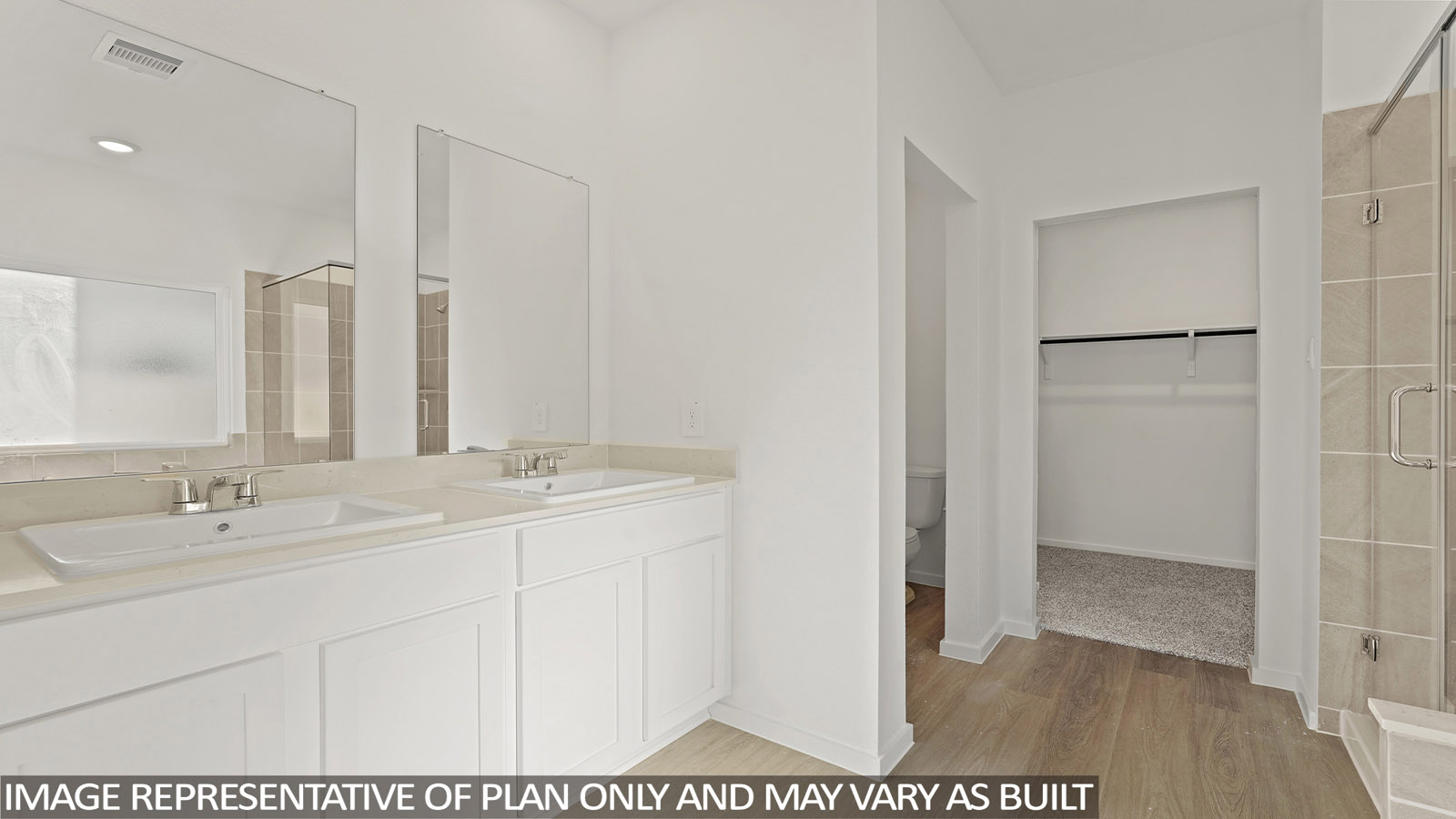 Primary bathroom with soaker tub and tile shower with semi frameless glass in New Waverly TX