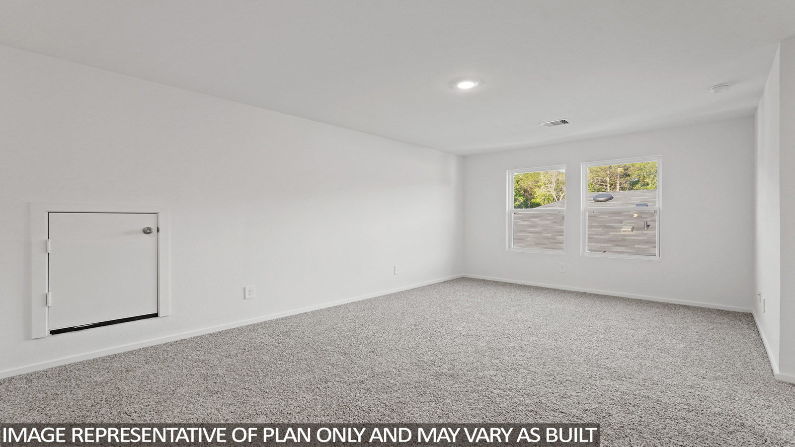 Second story game room with carpet flooring with bright windows in this multi functional space in New Waverly TX