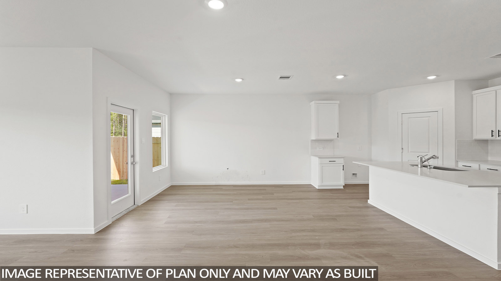 Spacious living area with vinyl flooring and bright windows in New Waverly TX