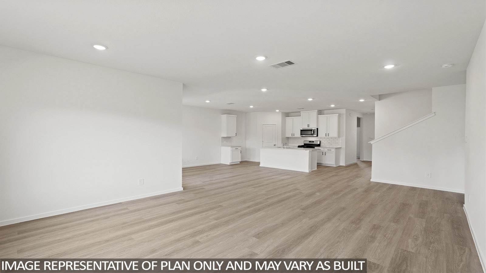Open concept living, dining, and kitchen area with vinyl flooring and bright windows