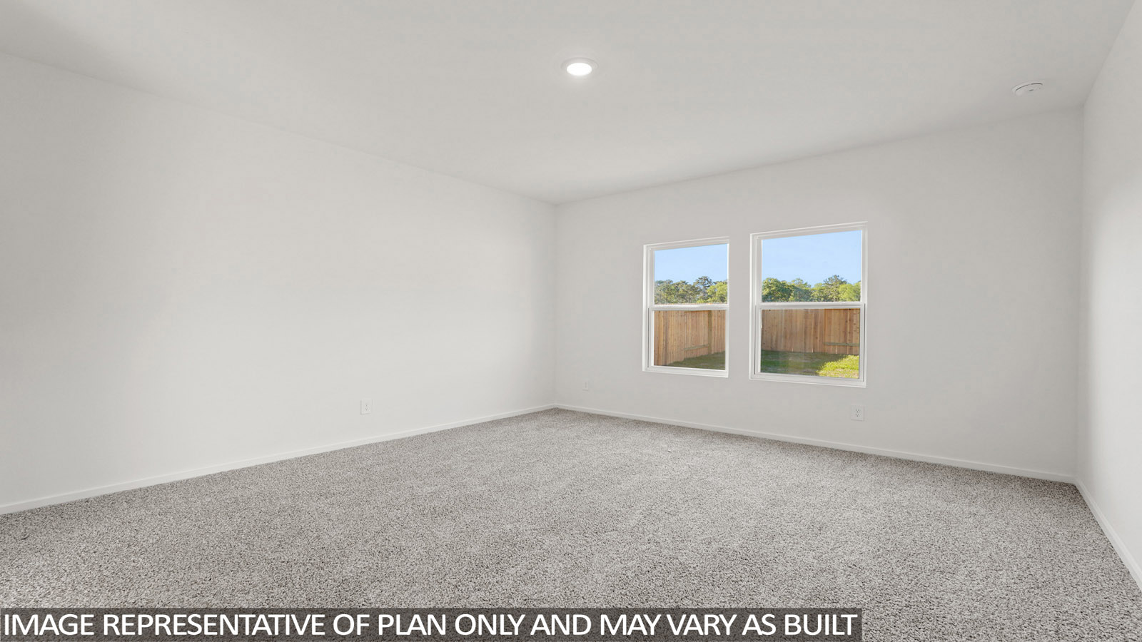 Large Primary bedroom with shag carpet flooring and bright window