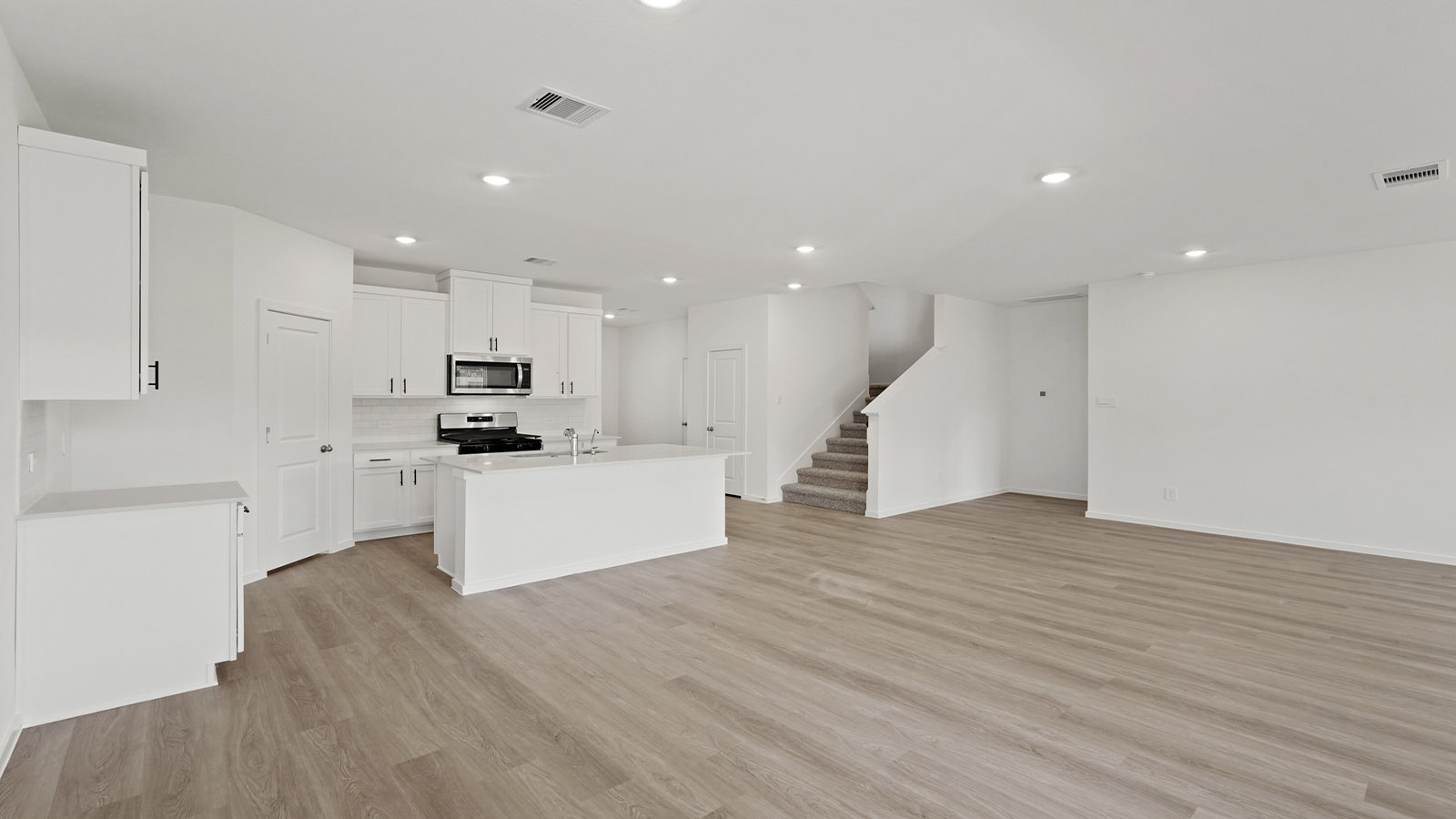 Open concept living, dining, and kitchen area