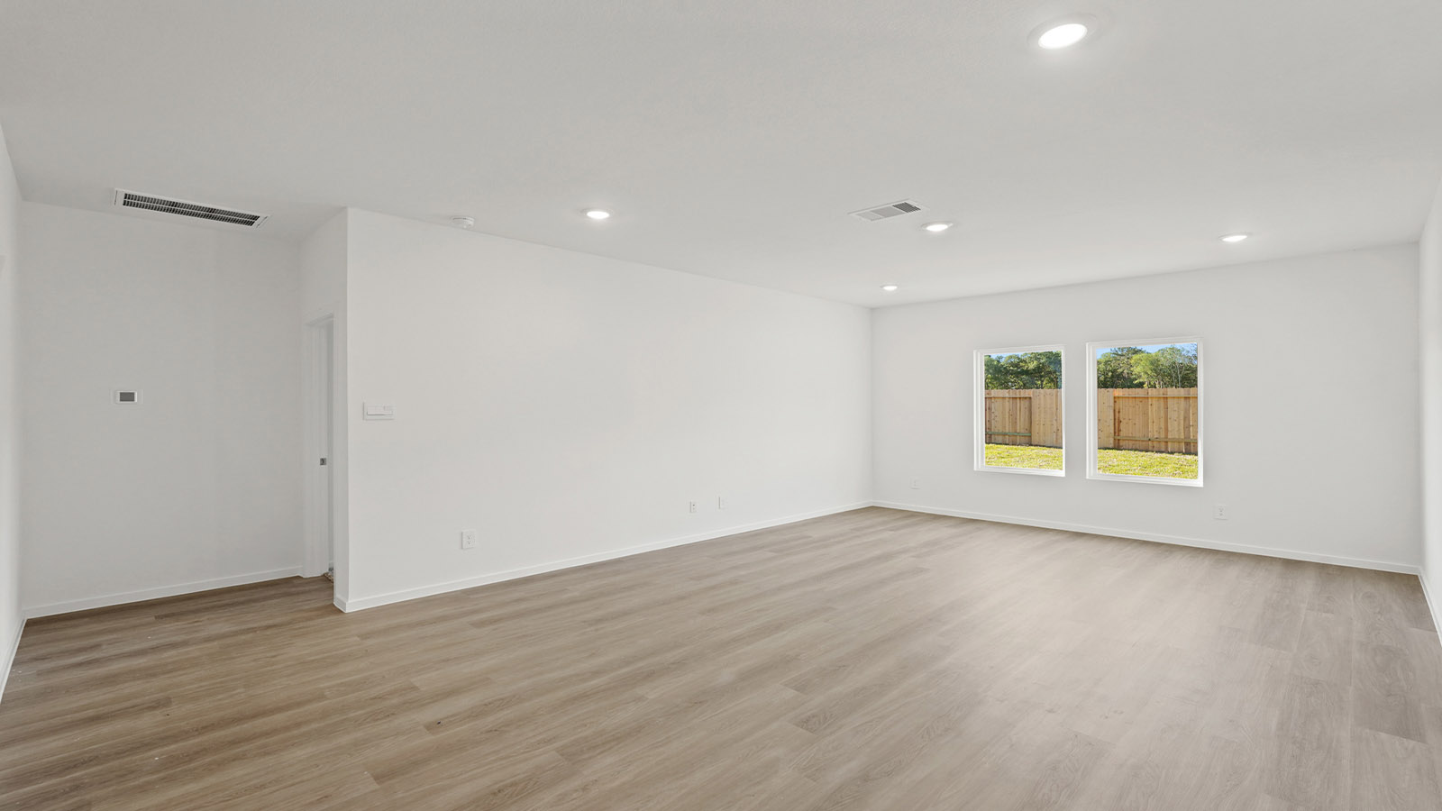 Open concept living, dining, and kitchen area