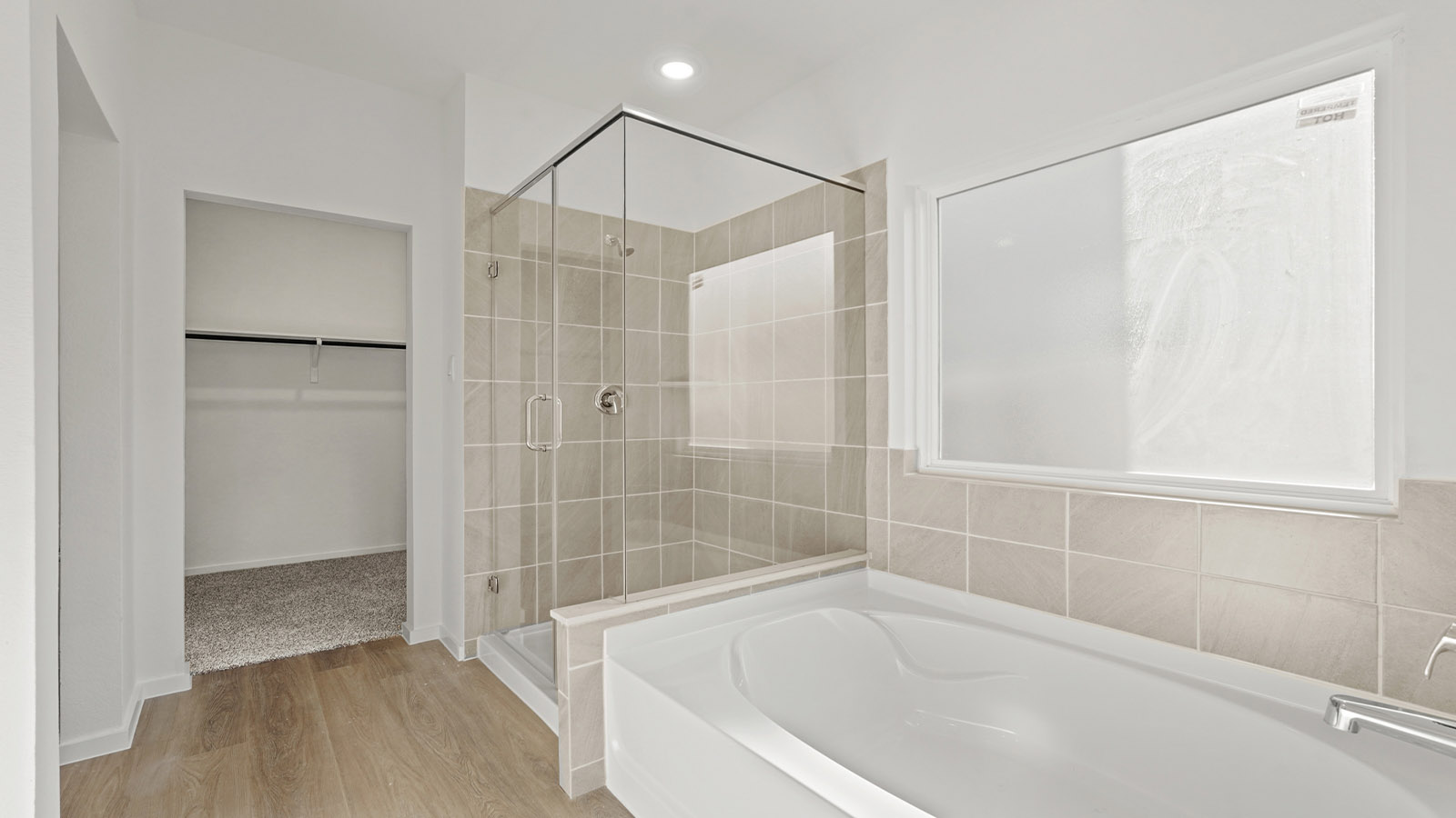 Primary bathroom with tub and shower