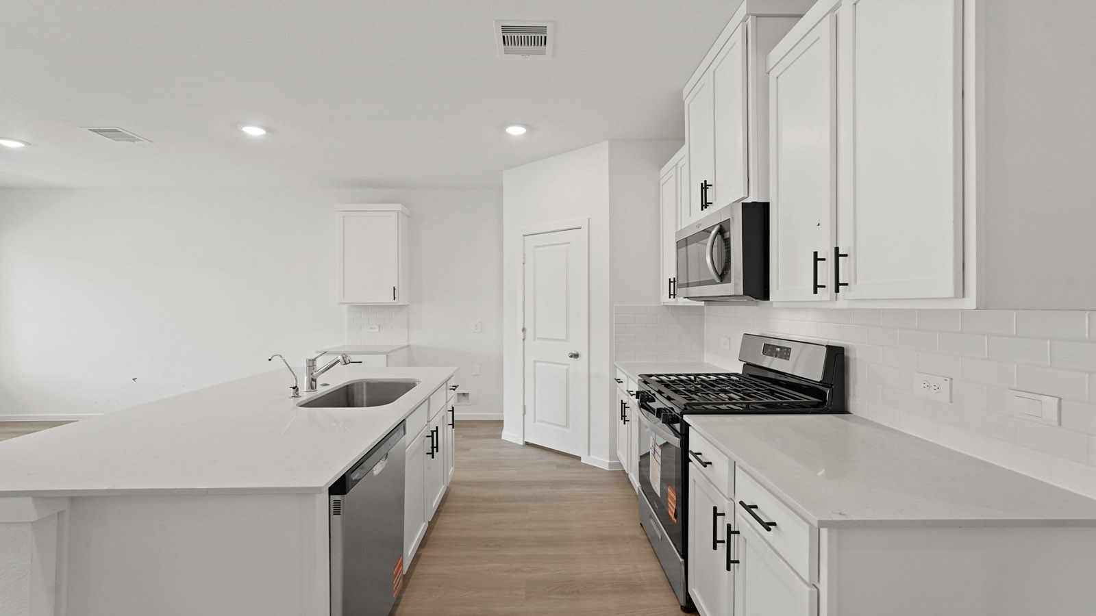 Kitchen with an island and vinyl floor