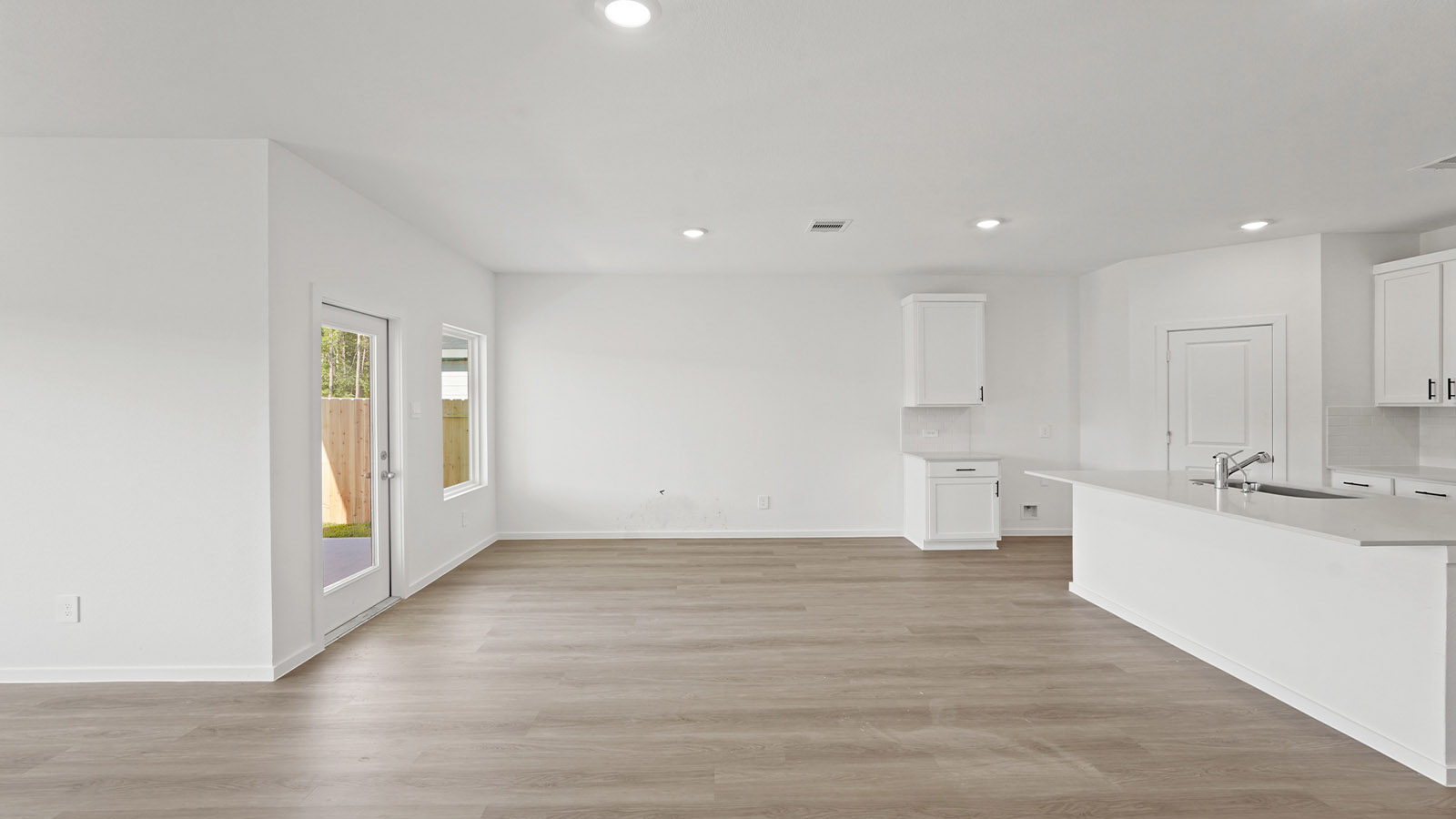 Open concept living, dining, and kitchen area