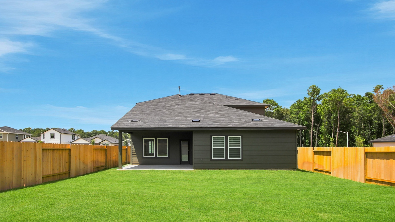 covered patio with jamies hardie siding and overhead lighting