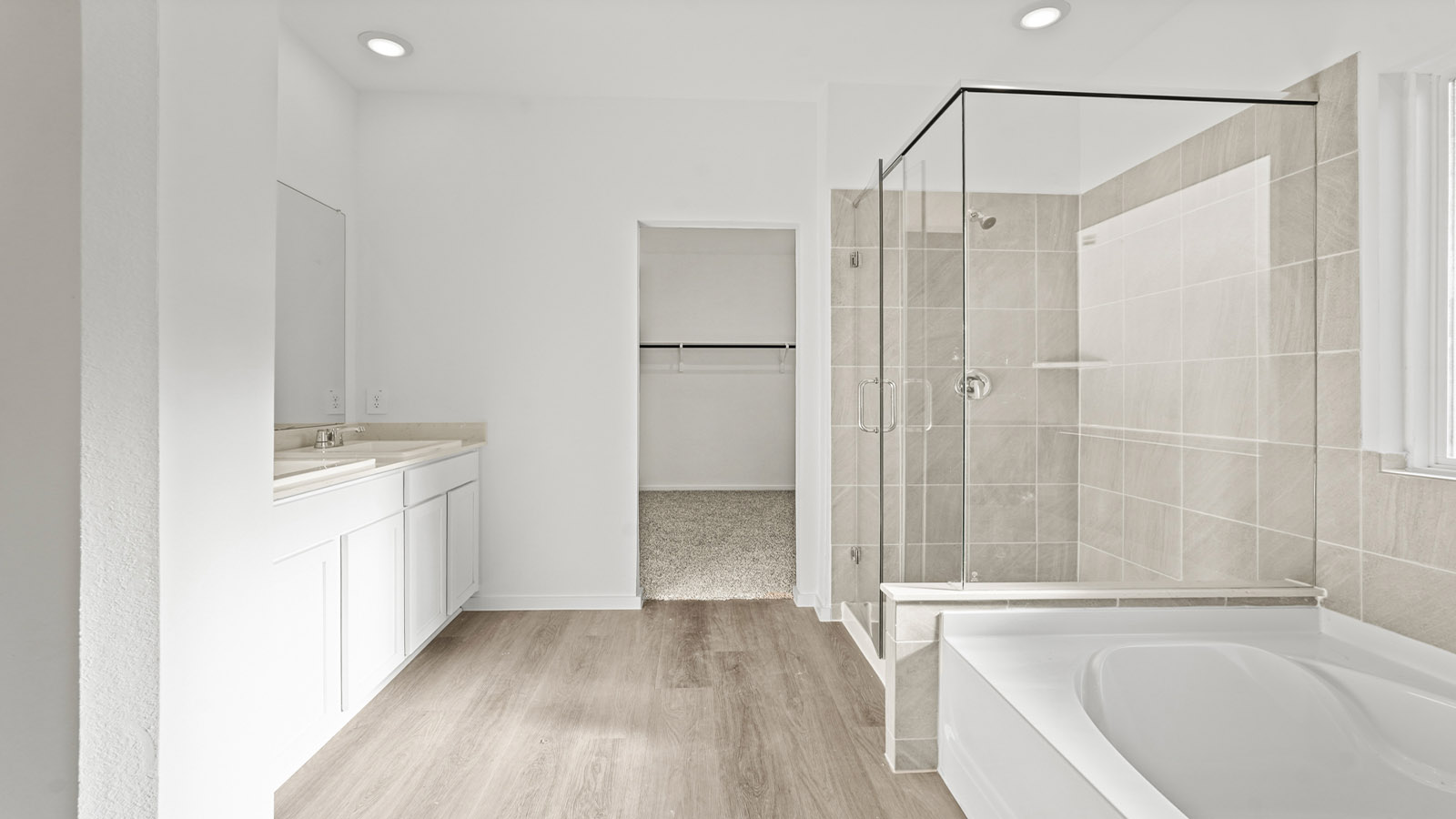 Primary bathroom with tub and shower