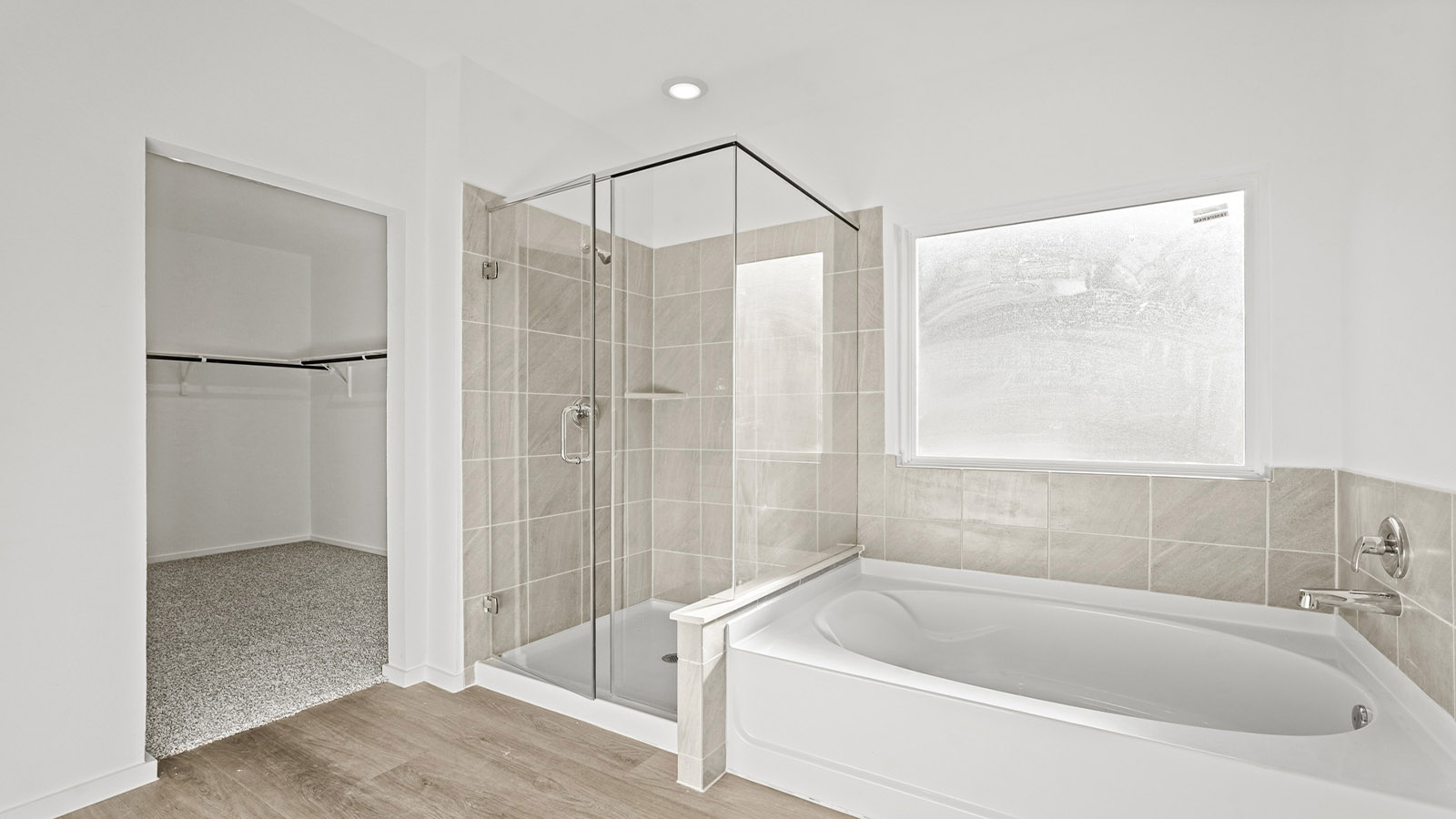 Primary bathroom with tub and shower
