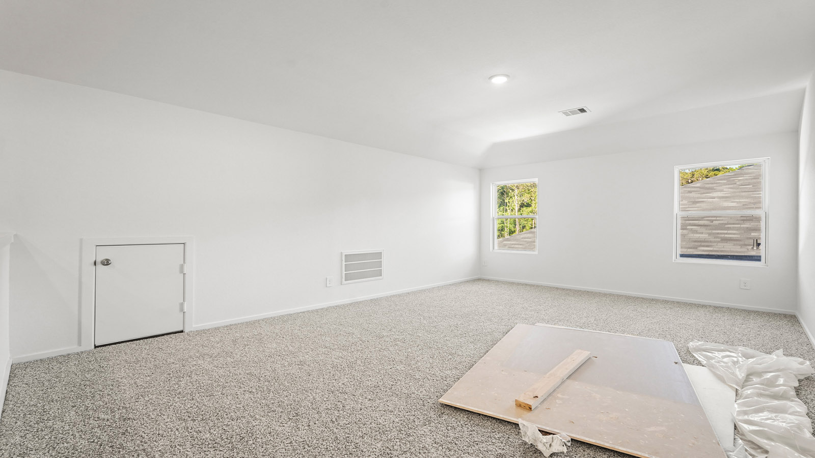 Second story game room with carpet flooring