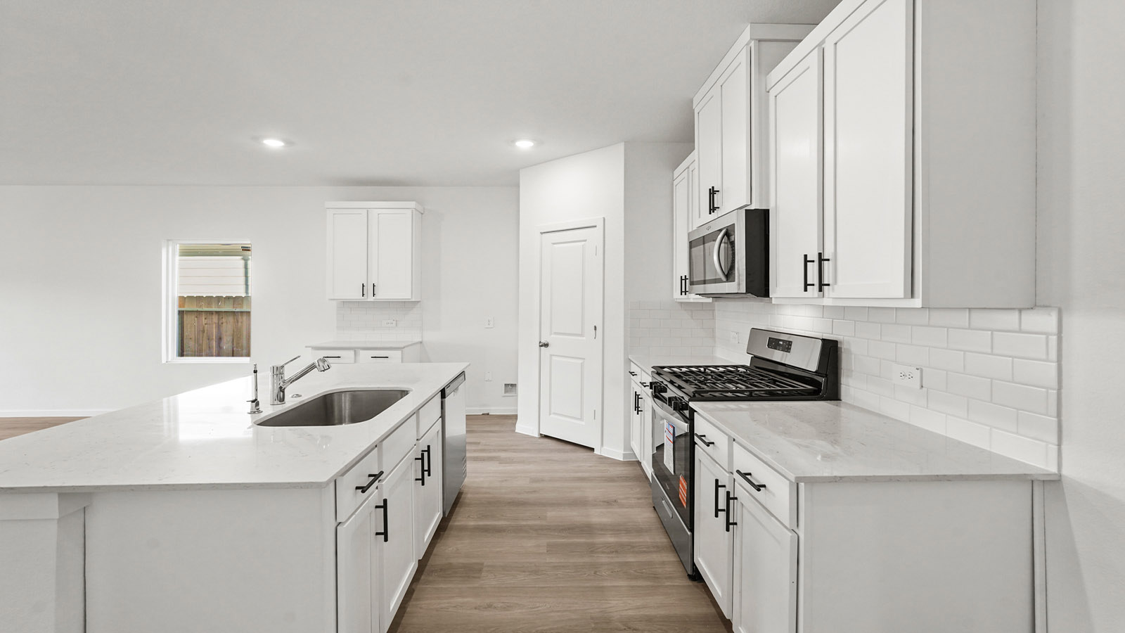 Kitchen with an island and vinyl floor