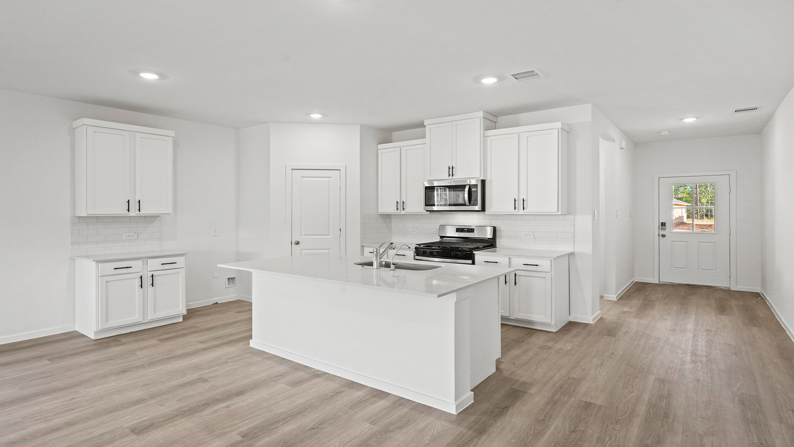 Kitchen with an island and vinyl floor