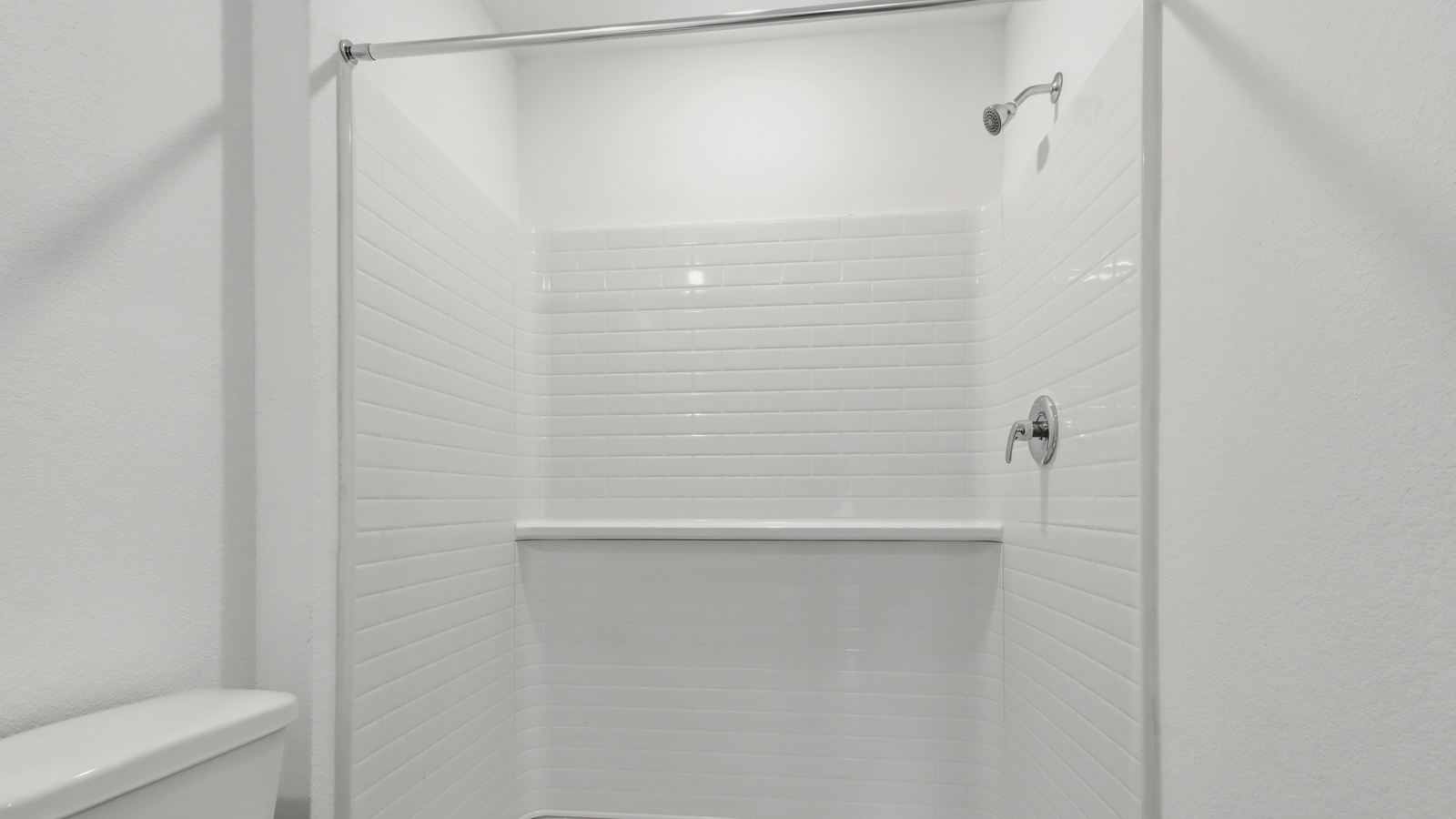 Primary bathroom with stand-alone shower with tiles and semi frameless glass in New Waverly TX