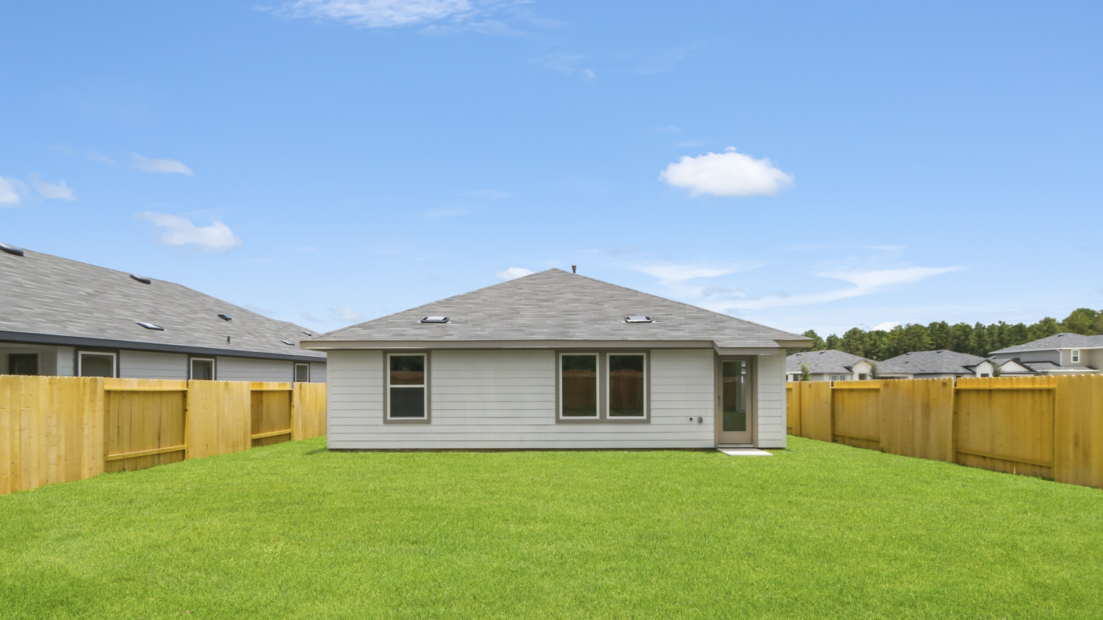 back of house with james hardie siding and glass back door