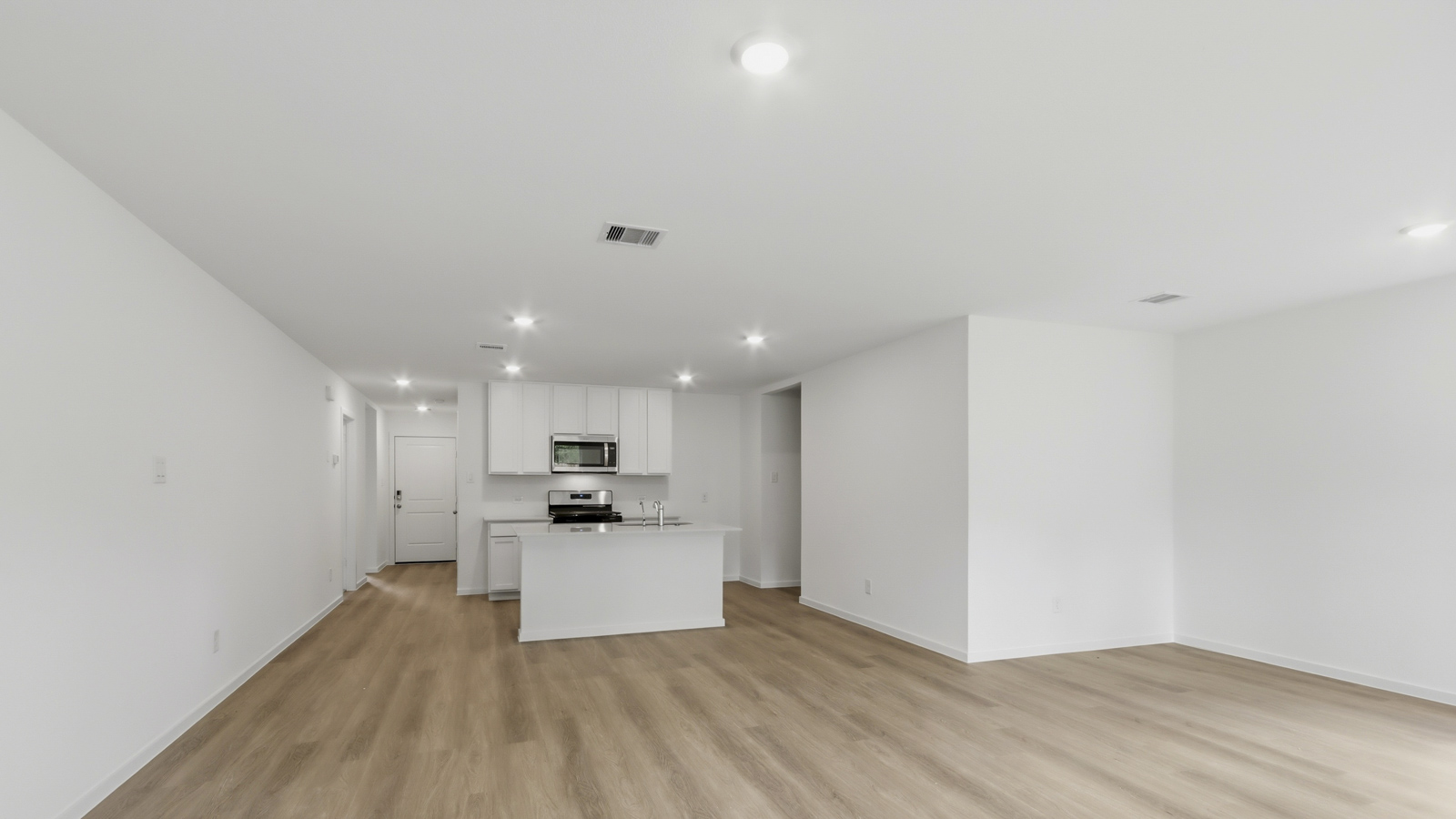 Spacious living area with vinyl flooring and bright windows in Katy TX