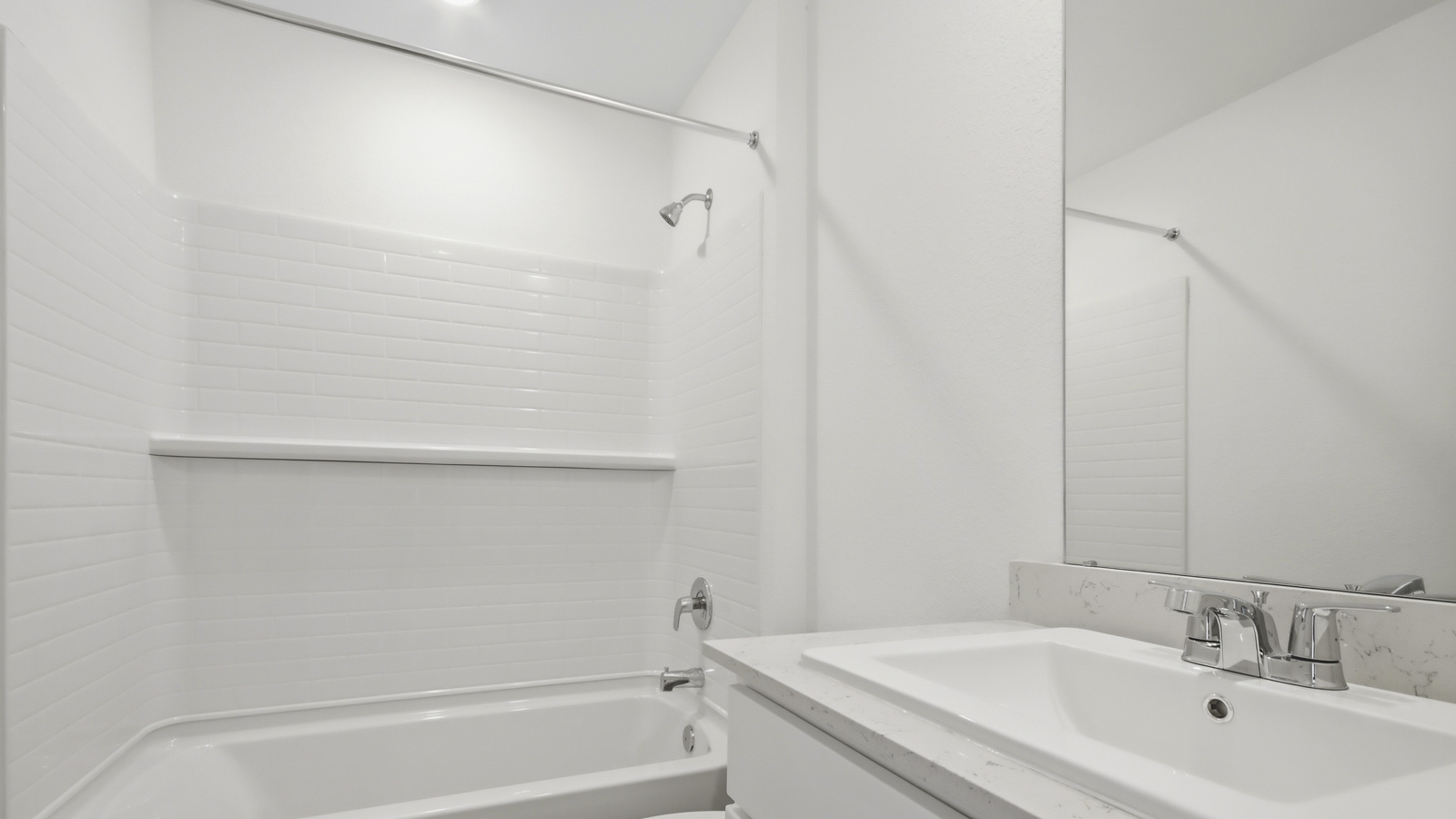 Primary bathroom with stand-alone shower with tiles and semi frameless glass in New Waverly TX