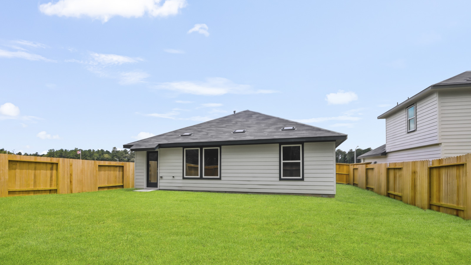 back of house with james hardie siding and glass back door