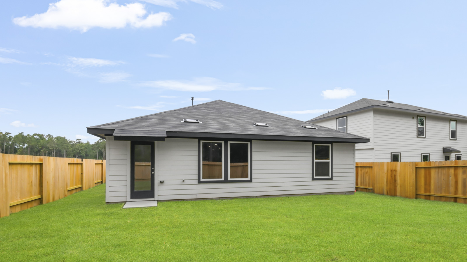 back of house with james hardie siding and glass back door
