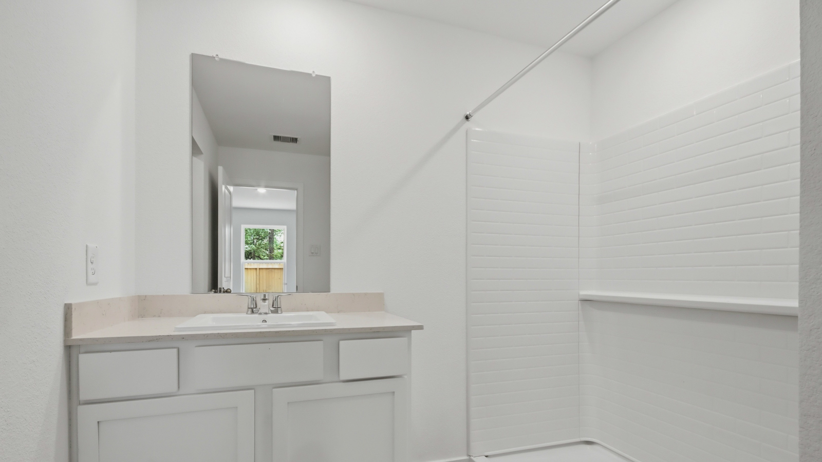 Primary bathroom with double sinks with quartz counter tops in New Waverly TX