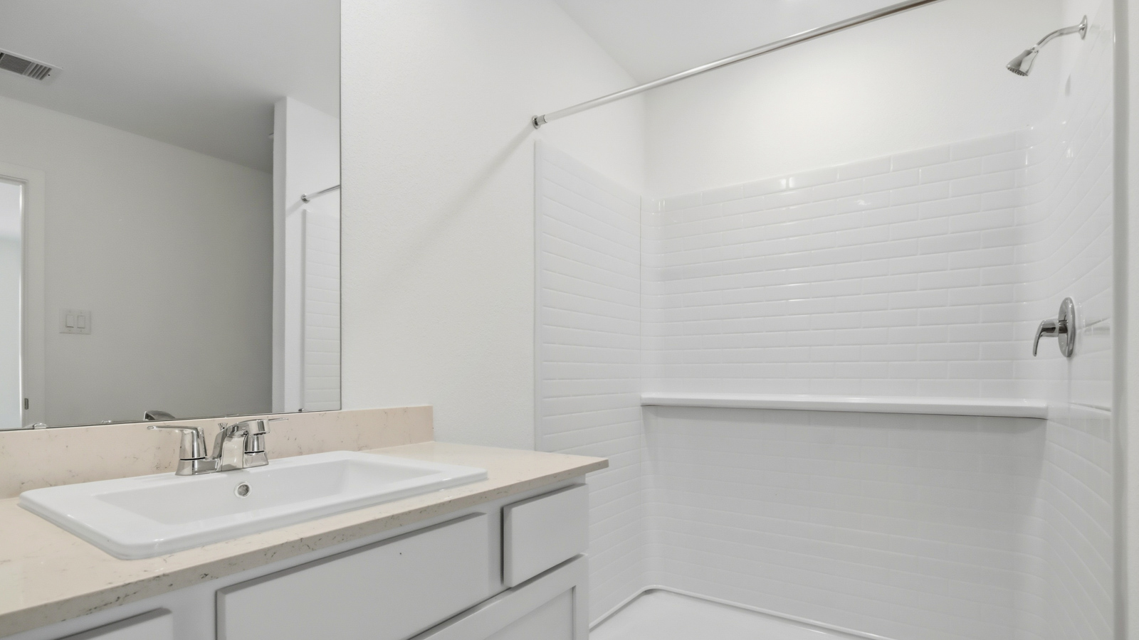 Primary bathroom with stand-alone shower with tiles and semi frameless glass in New Waverly TX
