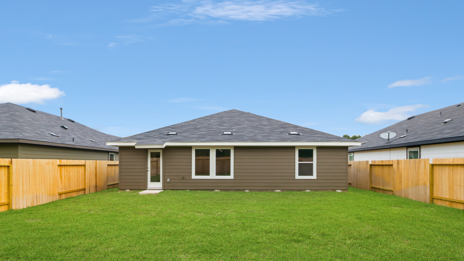 back of house with james hardie siding and glass back door