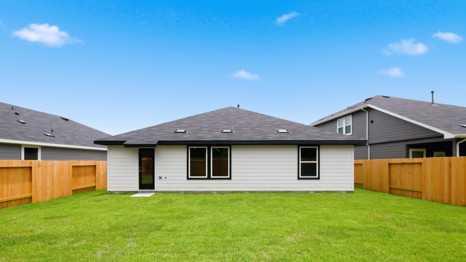 back of house with james hardie siding and glass back door
