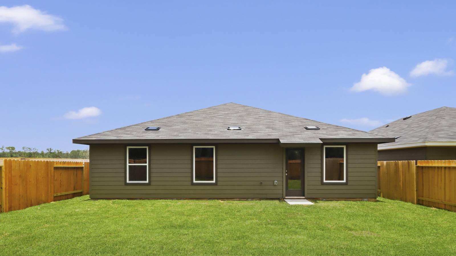 back of house with james hardie siding and glass back door