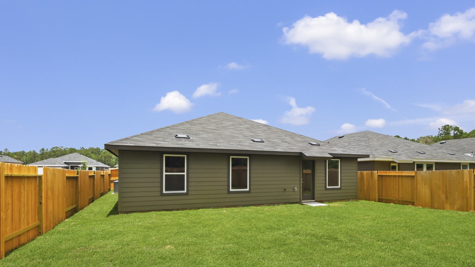 back of house with james hardie siding and glass back door