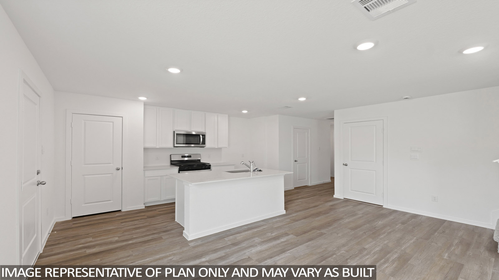 Kitchen with quartz countertops and modern hardware and an island and vinyl floor