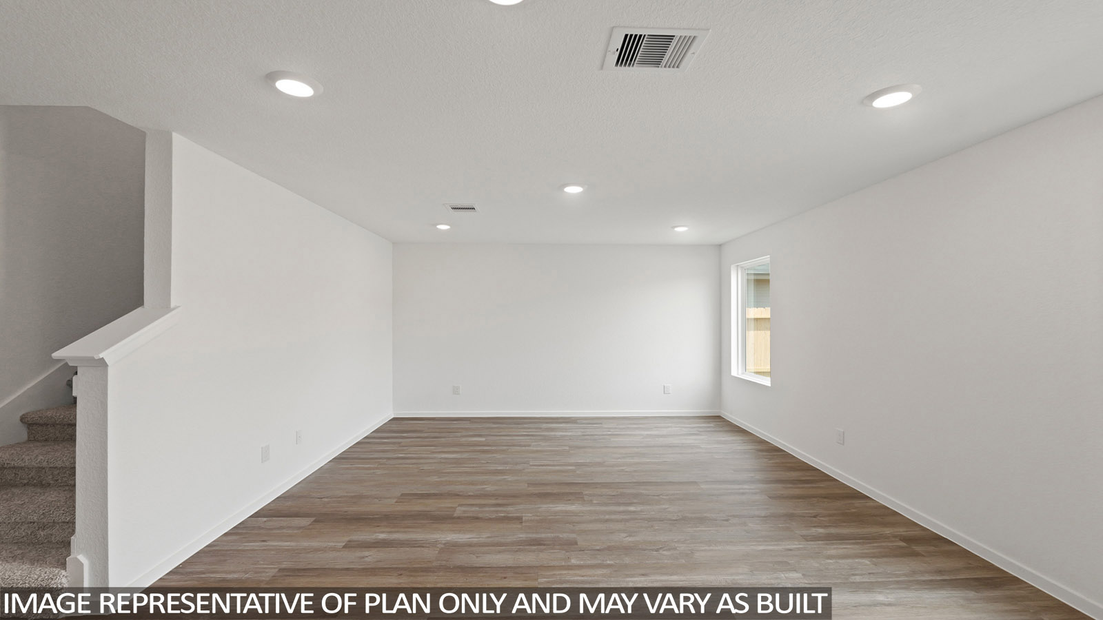 Spacious living area with vinyl flooring and bright windows in Willis TX