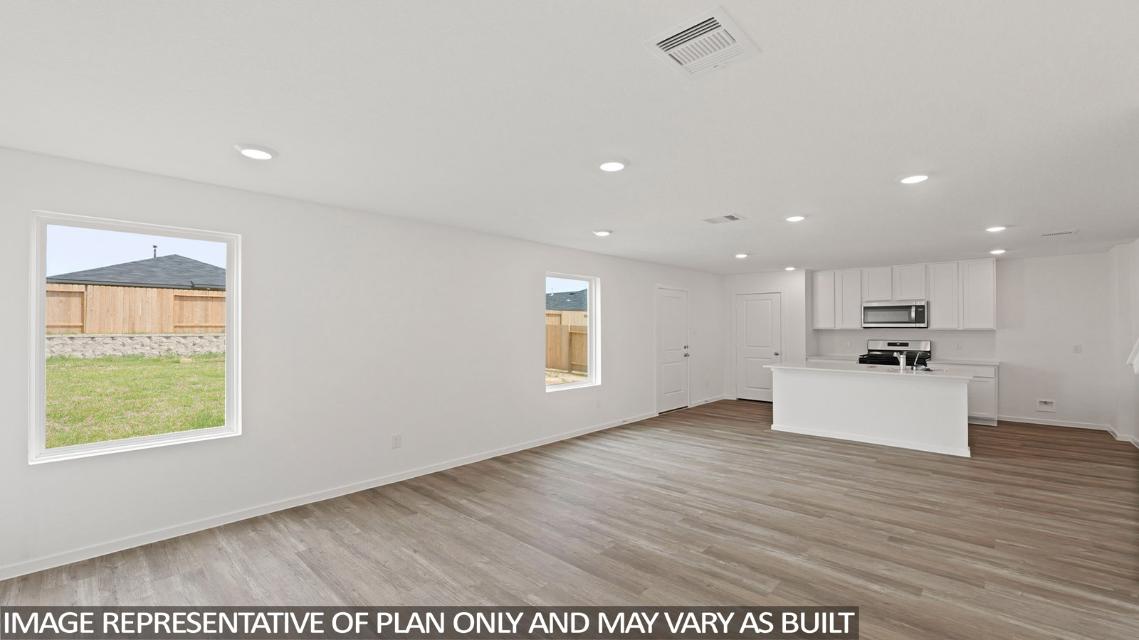 Kitchen with quartz countertops and modern hardware and an island and vinyl floor