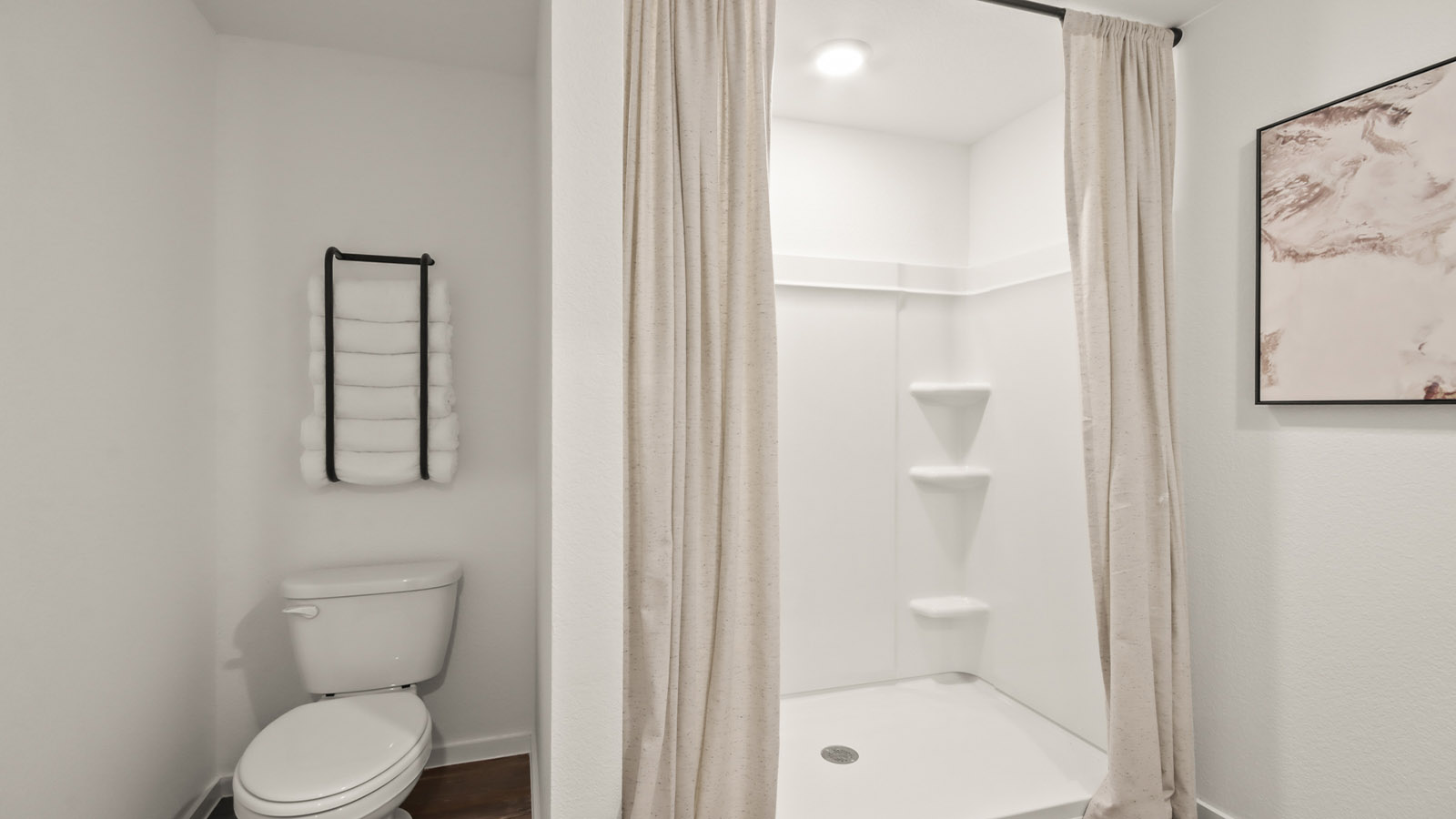 Primary bathroom with stand-alone shower with tiles and semi frameless glass in Willis TX