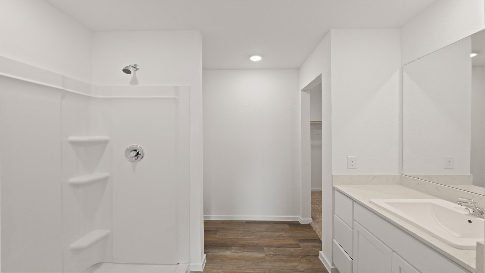 Primary bathroom with stand-alone shower with tiles and semi frameless glass in Willis TX