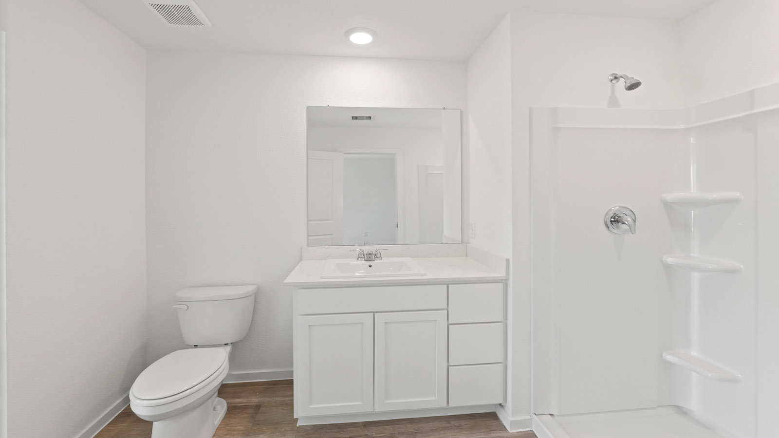 Primary bathroom with stand-alone shower with tiles and semi frameless glass in Willis TX