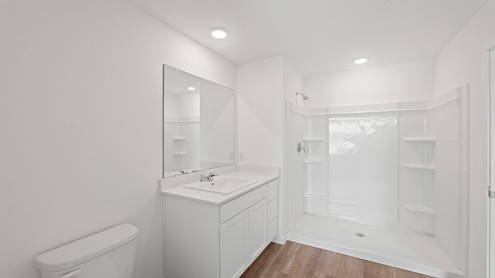 Primary bathroom with stand-alone shower with tiles and semi frameless glass in Willis TX